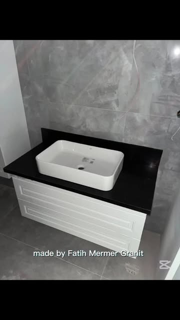 Quartz Countertops and Vessel Sinks Offer Modern Bathroom Elegance