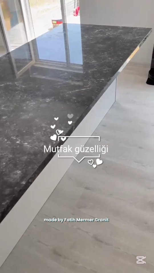 Modern Kitchen Design Trend: Black Marble Island with Integrated Lighting